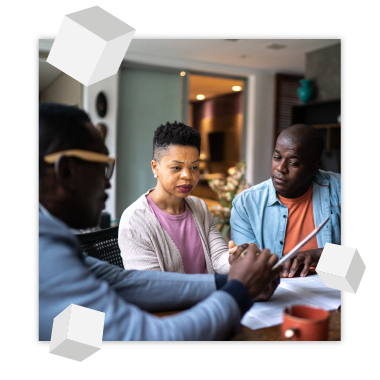 couple looking over trust document with trust officer