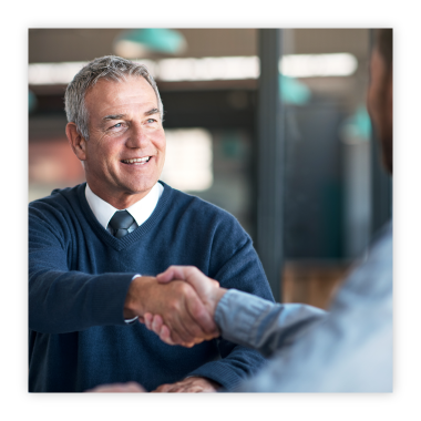 man shaking hands with trust officer