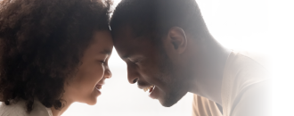 dad and daughter smiling together