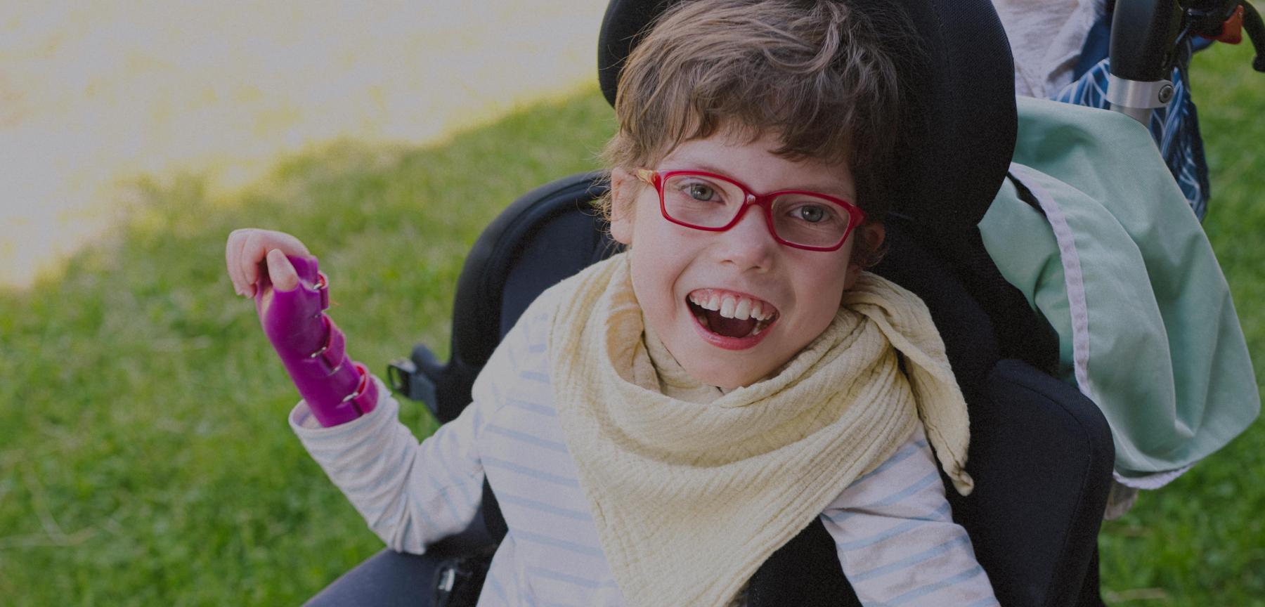 disabled girl in wheelchair smiling